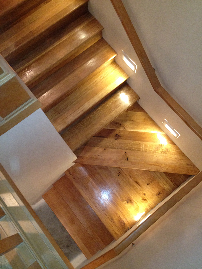 man checking wooden flooring